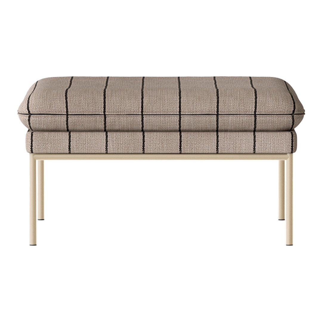 Beige upholstered ottoman with black grid pattern, featuring a sleek metal frame. Perfect for modern decor.