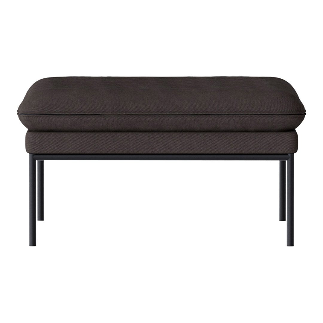 Dark grey upholstered ottoman with smooth, minimalist design and sleek black metal legs. Ideal for modern decor.