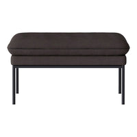 Dark grey upholstered ottoman with smooth, minimalist design and sleek black metal legs. Ideal for modern decor.