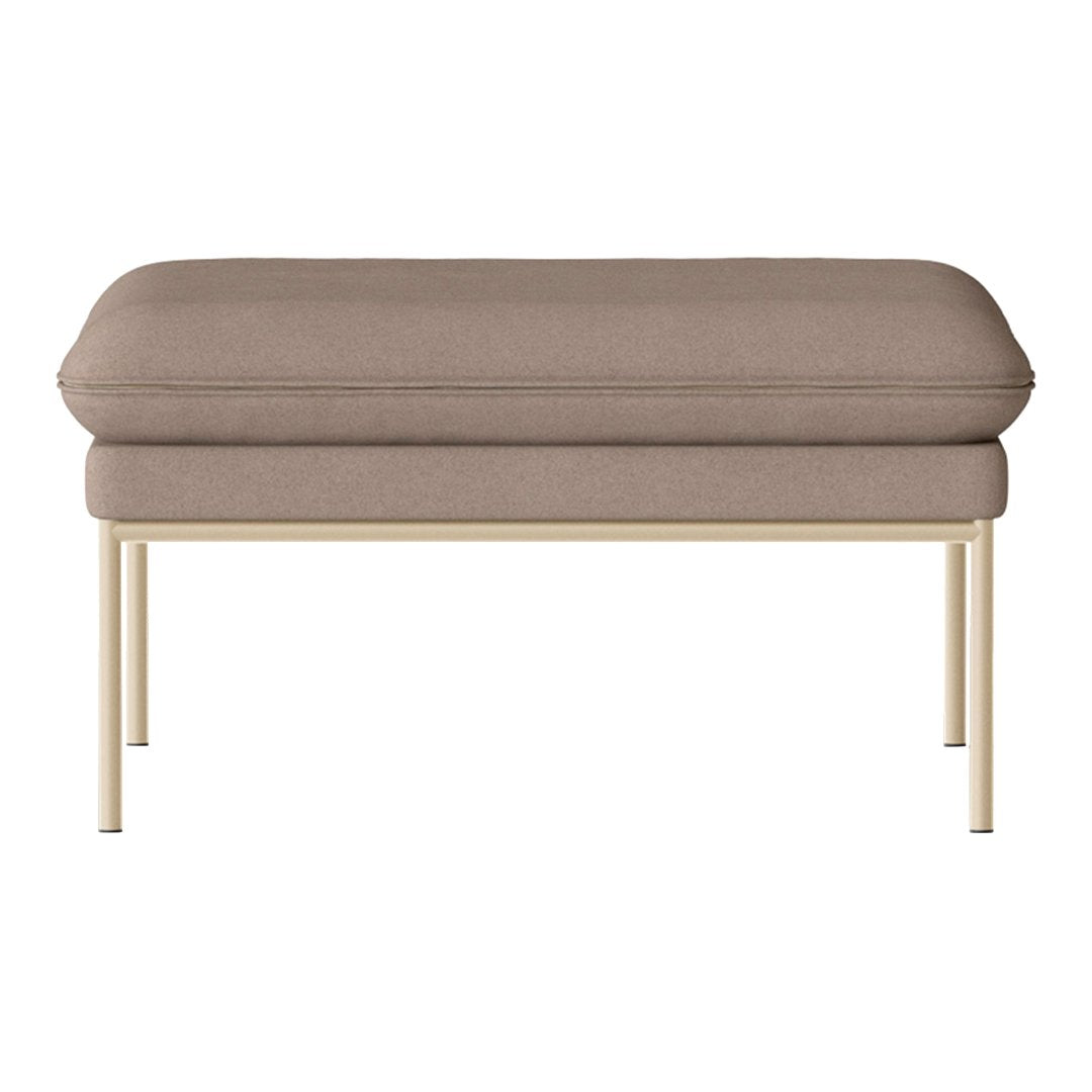 Soft taupe upholstery on a modern rectangular ottoman with sleek gold legs. Simple and elegant design.