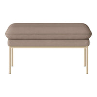 Soft taupe upholstery on a modern rectangular ottoman with sleek gold legs. Simple and elegant design.
