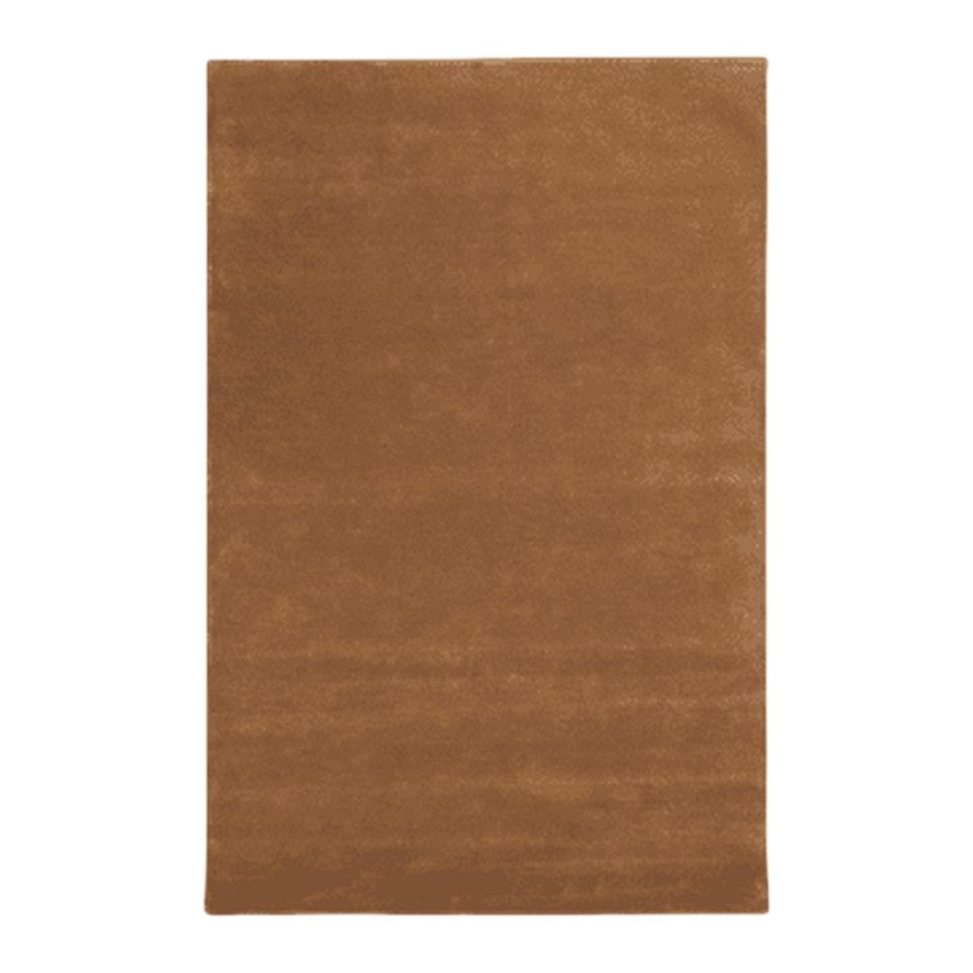 "Solid warm brown area rug with a soft texture, perfect for cozy home decor."