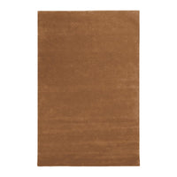 "Solid warm brown area rug with a soft texture, perfect for cozy home decor."