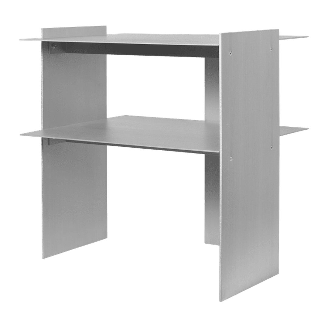 Silver metal shelf with a minimalist design, featuring two open tiers and a sleek, modern finish. Perfect for organization.
