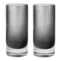 Set of two tall, clear glasses with a sleek ribbed pattern and gradient from transparent to black.