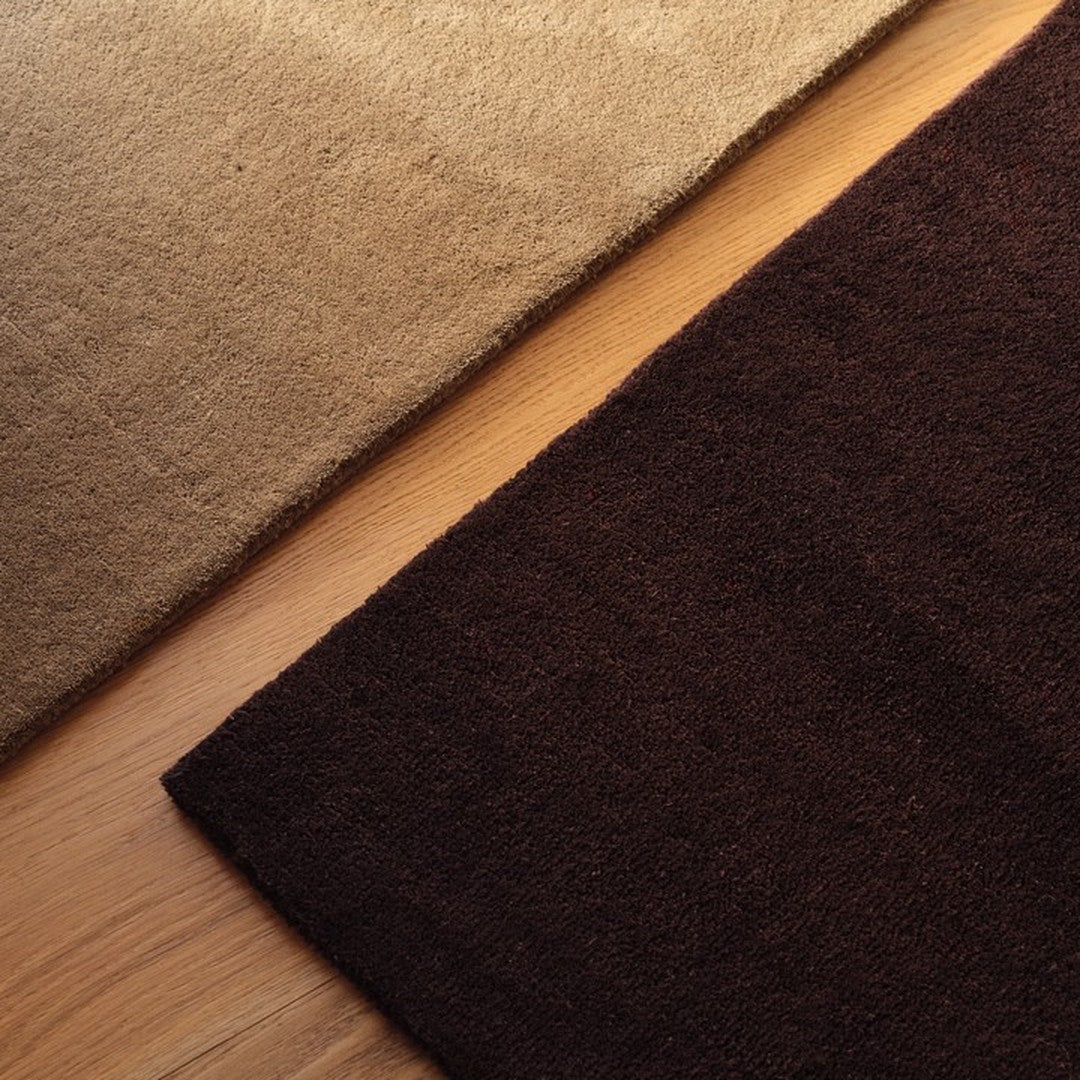 Textured brown and beige rugs showcasing rich earthy colors for a cozy home aesthetic.