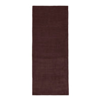 Deep burgundy solid area rug with a soft, textured finish, perfect for adding warmth to any space.