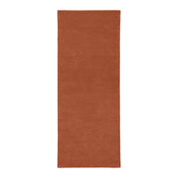 Rust orange rectangular rug with a smooth, solid texture, perfect for adding warmth to any space.