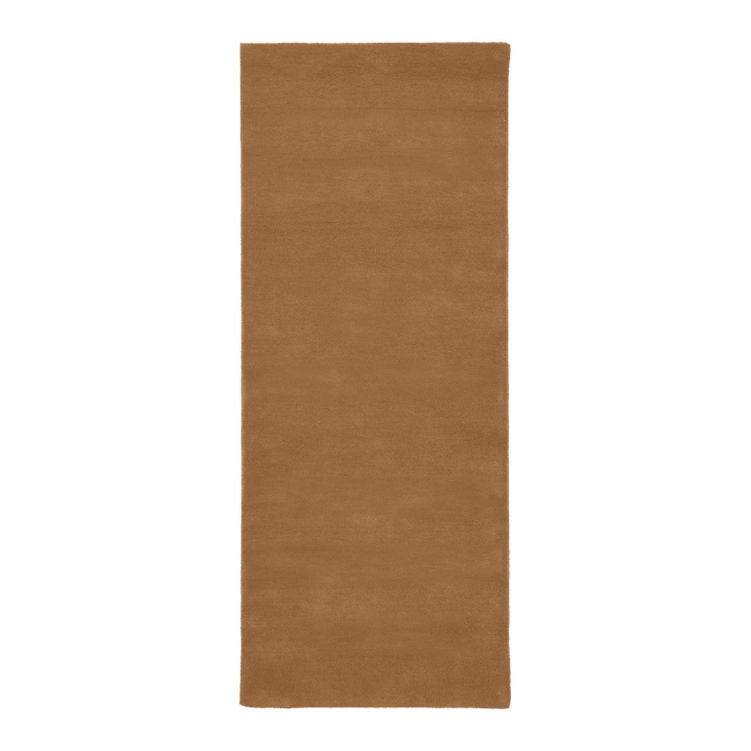 Solid brown area rug with a warm, earthy tone, featuring a smooth, textured surface suitable for various decor styles.