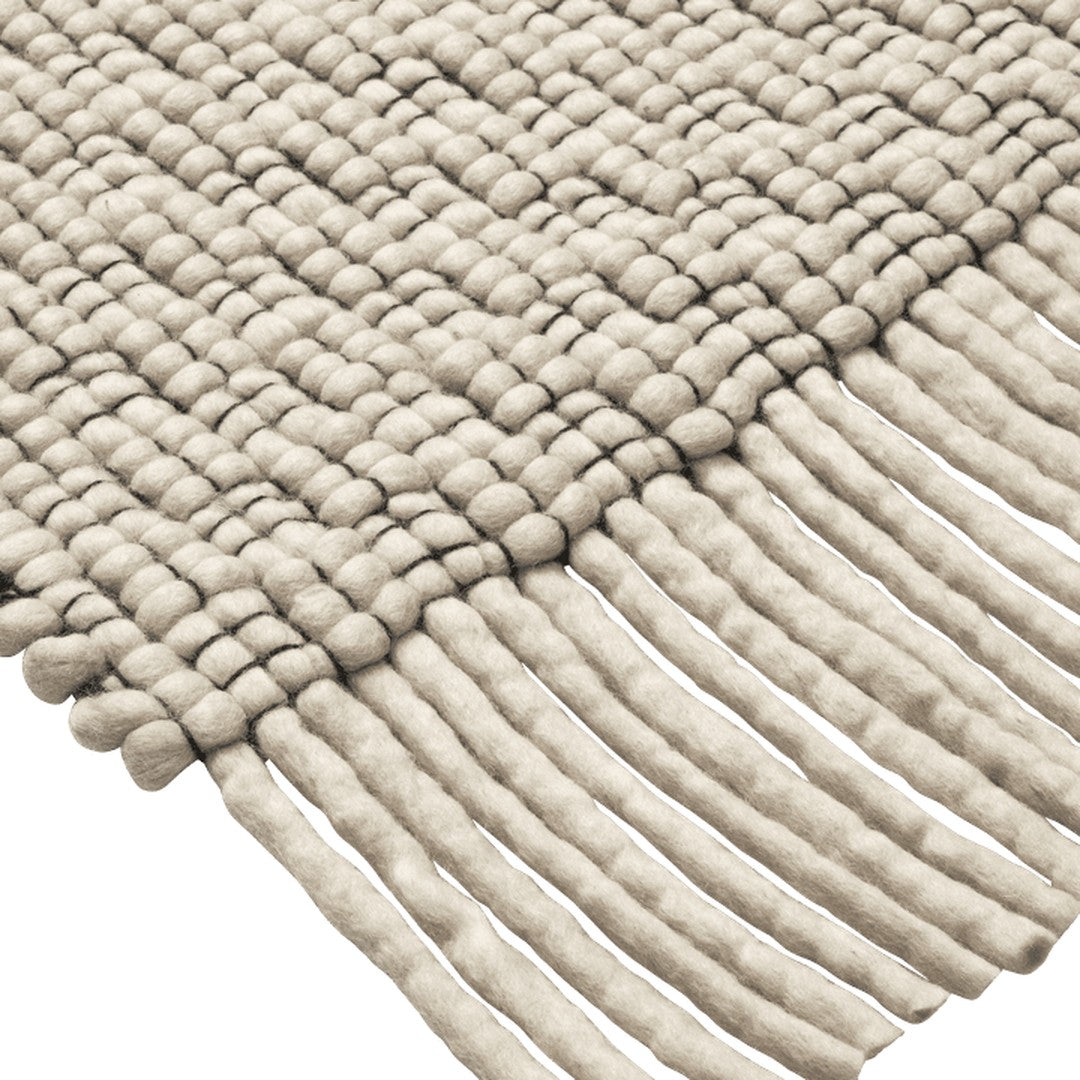 Textured beige woven rug with fringe detail, showcasing a patterned design of loops and lines. Perfect for any decor.