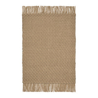 Tan textured area rug with a woven pattern and fringed edges. Perfect for cozy, neutral decor.
