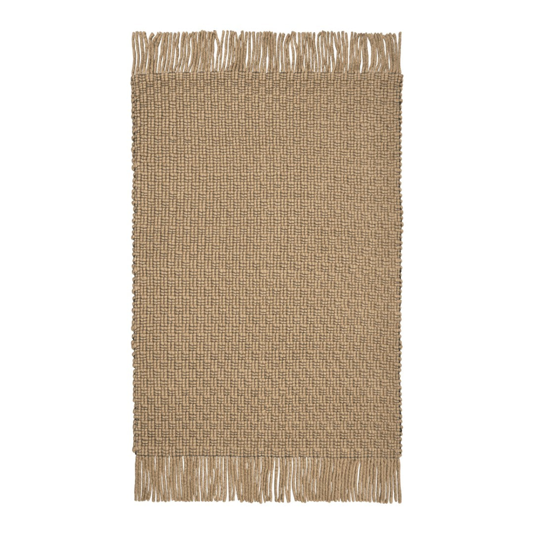 Tan woven rug with a textured pattern and fringed edges, offering a warm, natural aesthetic.
