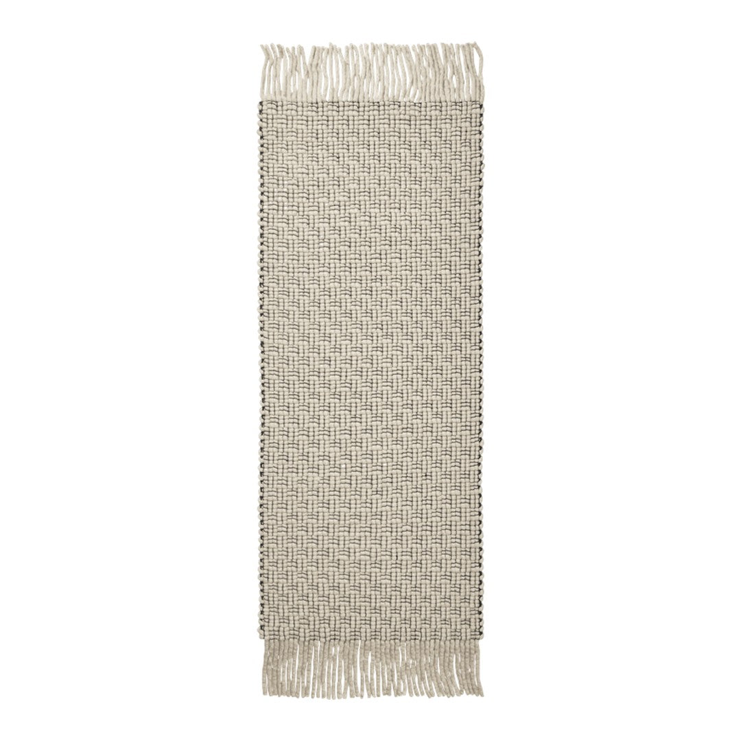 Beige runner rug with a textured diamond pattern and fringed edges. Perfect for adding warmth and style to any space.