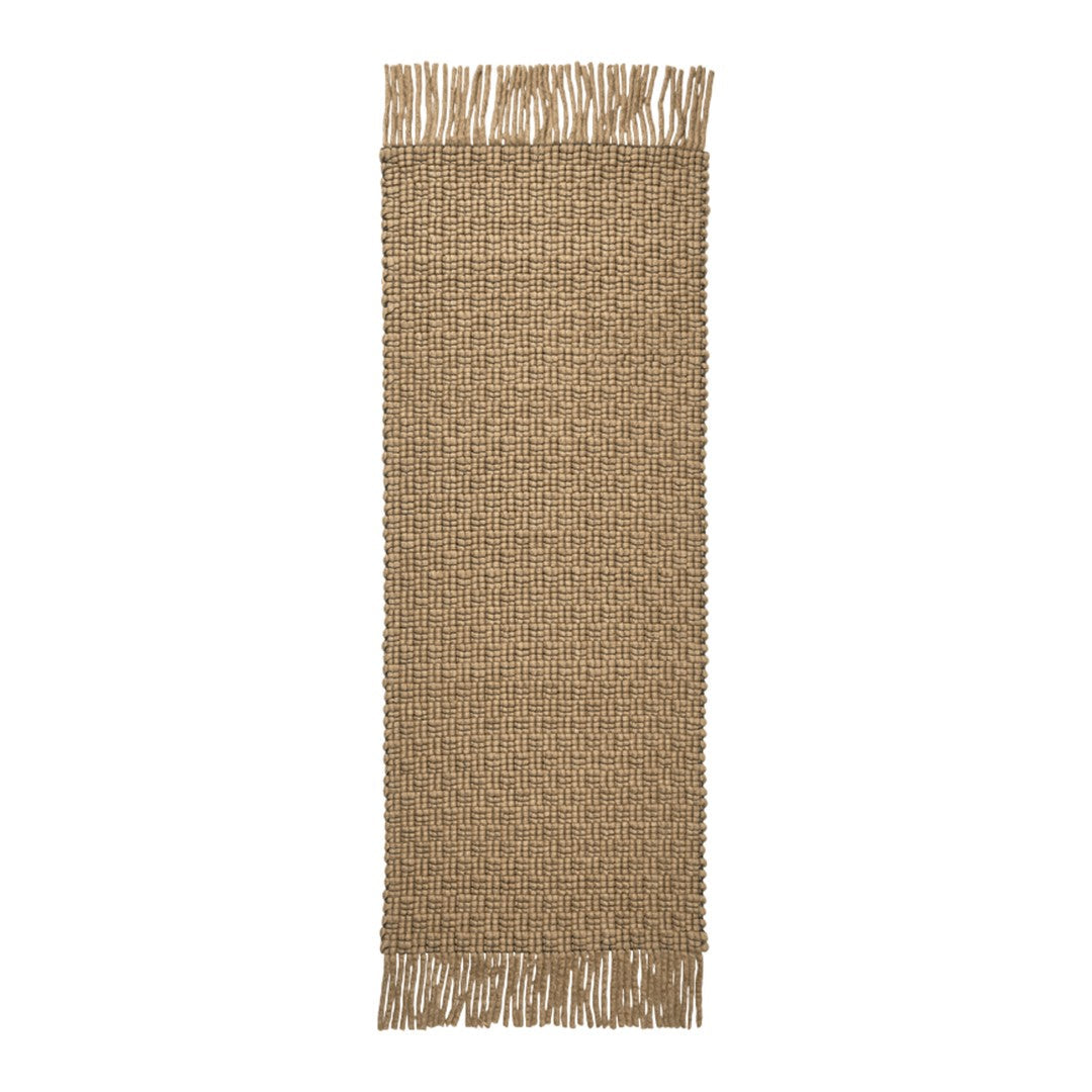 Natural woven beige runner rug with fringed edges, showcasing a textured pattern for a cozy touch.