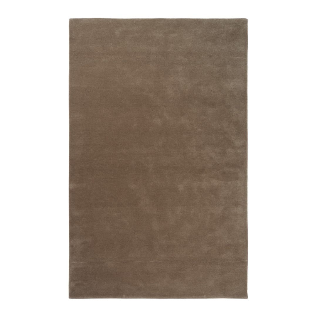 Brown solid area rug with a smooth texture, perfect for adding warmth and elegance to any space.