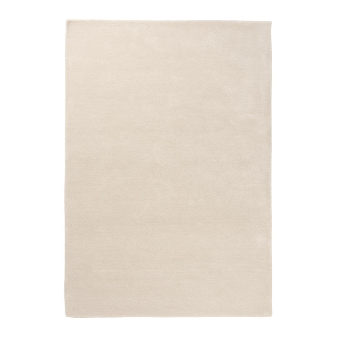 Beige textured area rug with a smooth finish and minimalist design. Ideal for neutral decor.