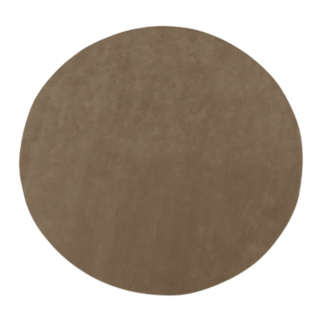 Round suede rug in a warm taupe color with a smooth, solid pattern. Ideal for modern home decor.