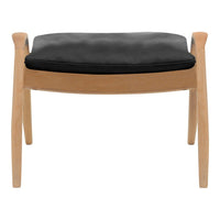 Black cushioned ottoman with natural wood legs, featuring a sleek and minimalist design. Perfect for modern interiors.