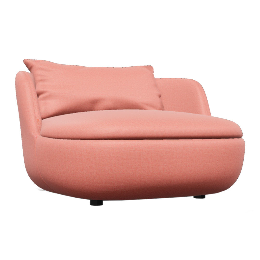 Round, peach-colored chair with smooth, textured fabric and a plush pillow for added comfort. Perfect for modern decor.