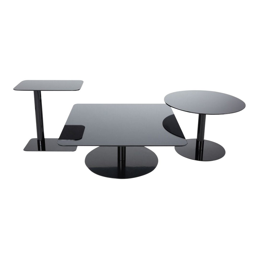 Modern black glass coffee table set with sleek geometric patterns and polished surfaces. Ideal for contemporary decor.