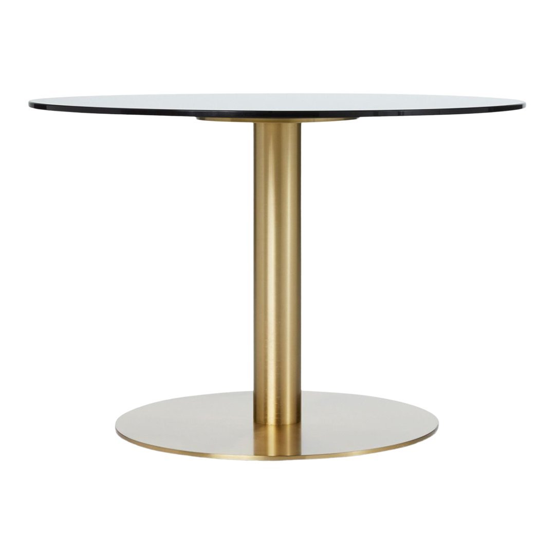Round black table top supported by a sleek gold base, featuring modern, minimalist design and elegant color contrast.