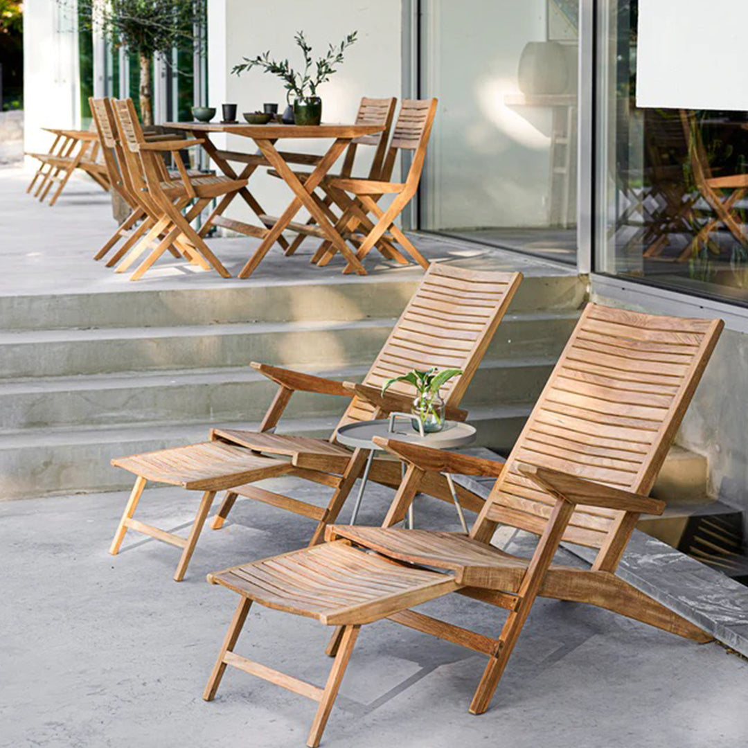 Natural wood tones with slatted patterns in a modern outdoor furniture set. Ideal for patio or garden decor.