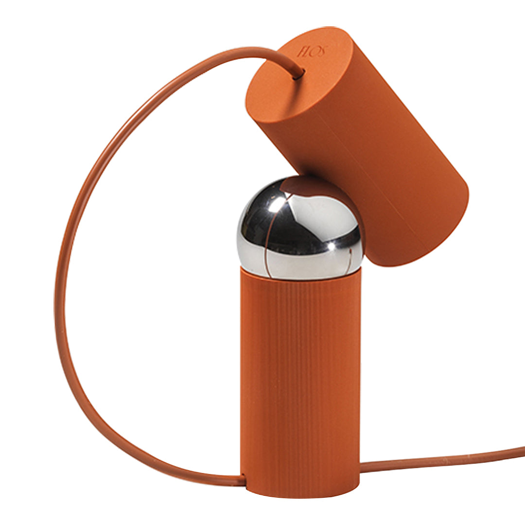 Stylish orange and chrome earbud holder with a sleek cylindrical design and textured finish. Perfect for modern aesthetics.