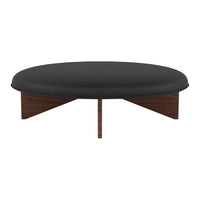 Black circular coffee table with wooden triangular base, modern minimalist design. Perfect for stylish living spaces.