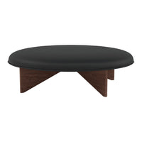 Round black coffee table with a smooth surface and stylish walnut wood legs. Modern design enhances any decor.