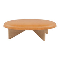 Round coffee table with a smooth tan leather top and natural wood triangular legs, showcasing a minimalist design.