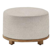 Light beige round ottoman with textured fabric and a wooden base, perfect for modern home decor.