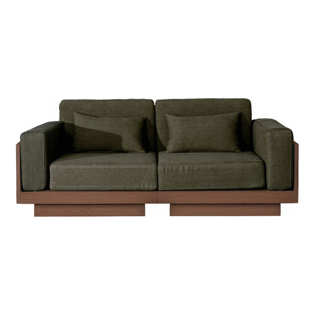 Green fabric sofa with a smooth texture and wooden base, featuring clean lines and a modern design.