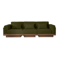 Olive green sofa with three plush cushions and a sleek wooden base, showcasing a modern and minimalistic design.