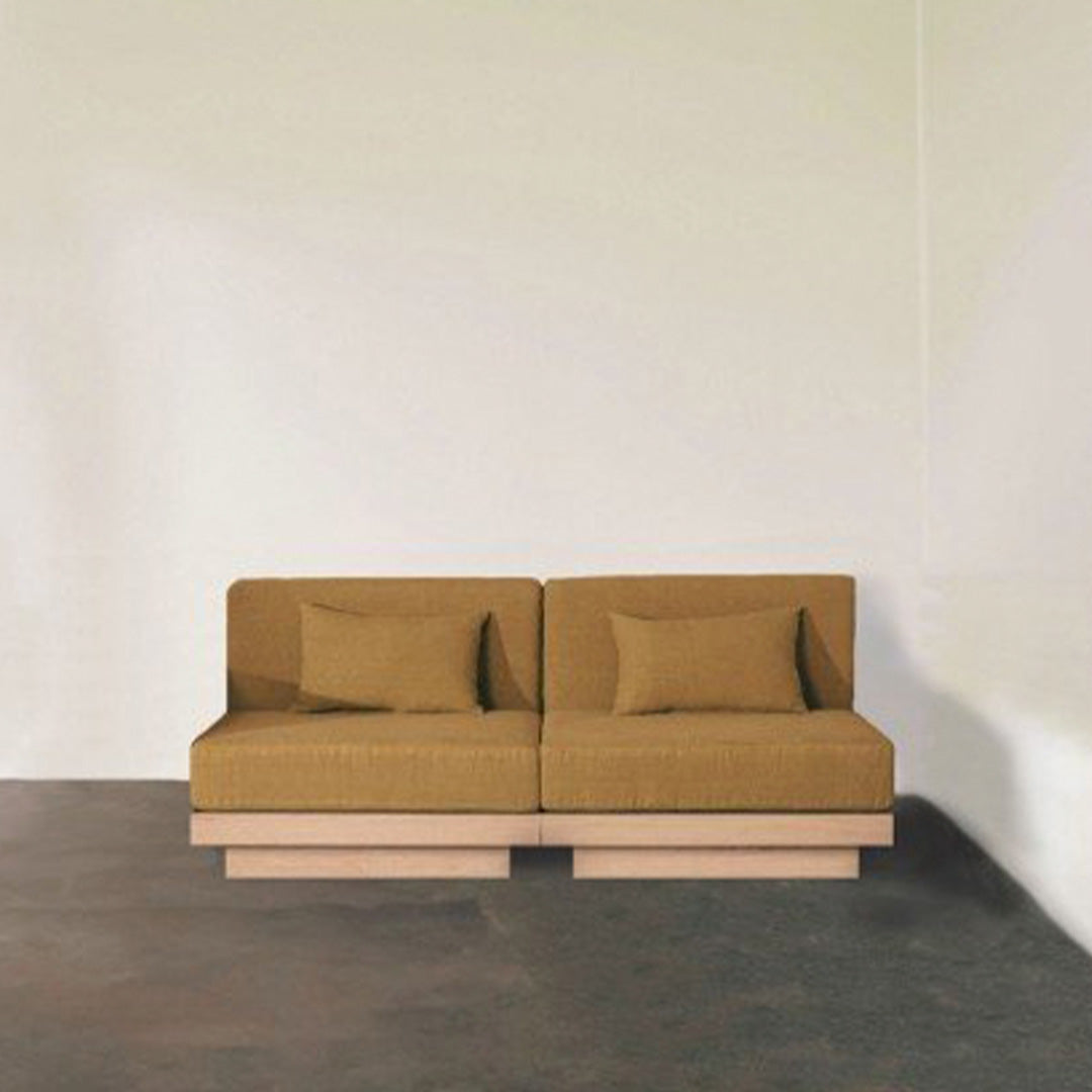 Modern two-seater sofa in warm mustard yellow with a simple, textured pattern and light wood base.