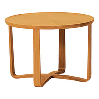 Natural oak round coffee table with smooth wood grain finish and minimalist design.