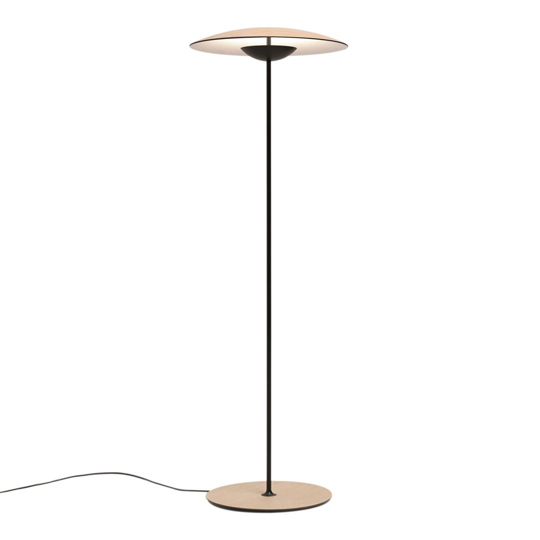 Minimalist black and beige floor lamp with a sleek, round shade and smooth, modern finish.