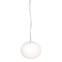 White round pendant lamp with a sleek, minimalist design and a smooth finish, hanging from a thin wire.