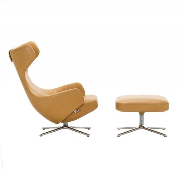 "Modern swivel chair and ottoman in soft mustard yellow leather with sleek chrome base."
