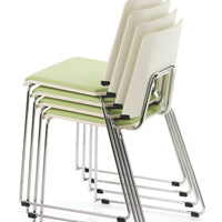 Stacked chairs featuring a sleek white and green color combination with a modern chrome base.