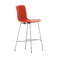 Orange plastic barstool with sleek silver legs, perfect for modern interiors. Stylish and vibrant accent piece.