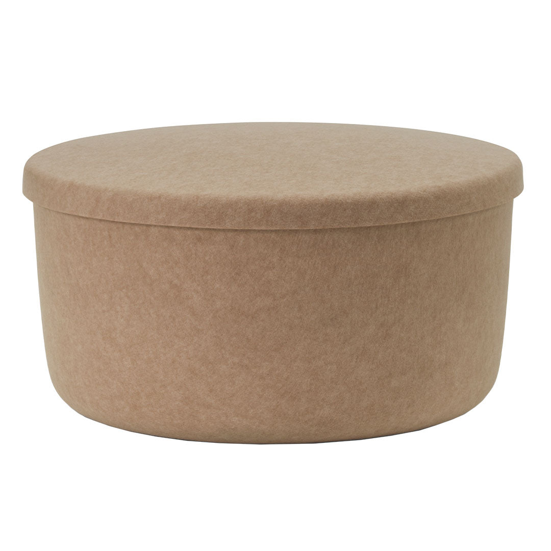 Round, beige storage box with a smooth fabric texture and minimalistic design, perfect for organizing any space.
