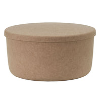 Round, beige storage box with a smooth fabric texture and minimalistic design, perfect for organizing any space.
