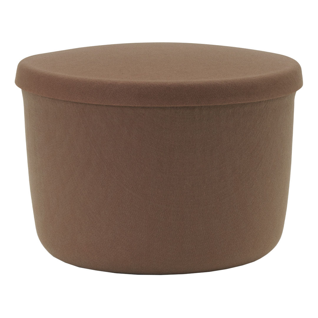 Brown upholstered storage ottoman with a smooth, round shape, perfect for modern decor.