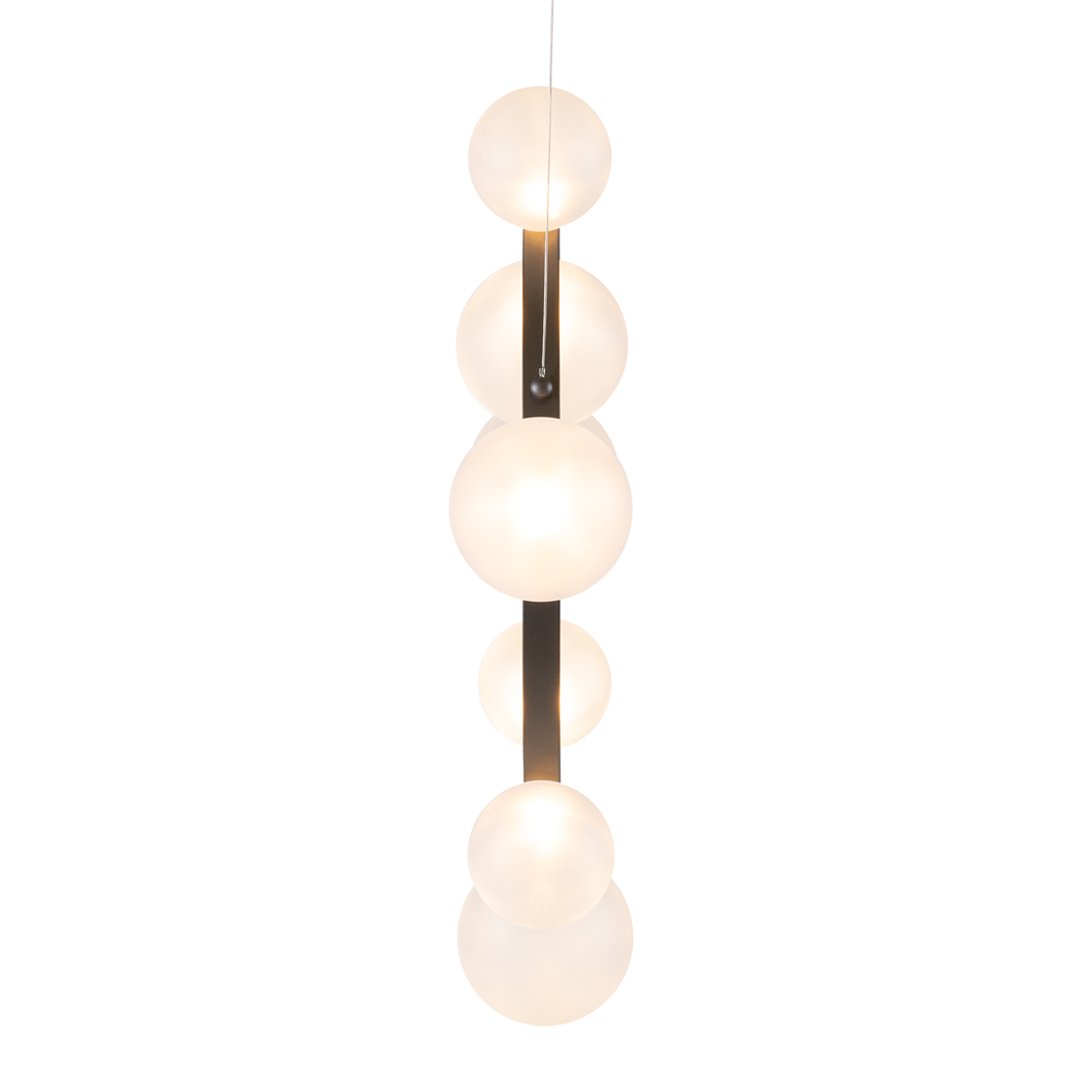 Modern pendant light featuring six frosted white glass spheres on a sleek black rod. Elegant and minimalist design.