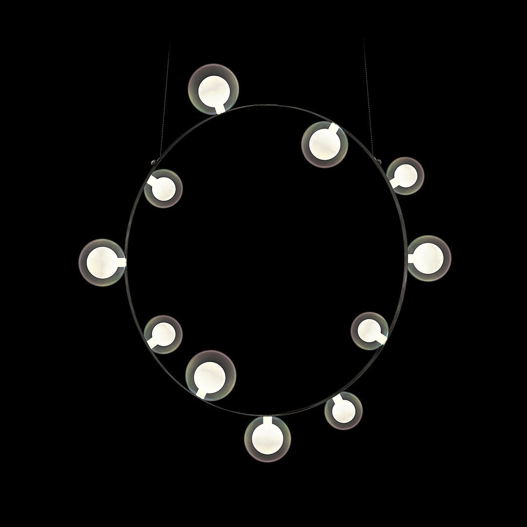 Modern circular pendant light with white bulbs against a sleek black background, showcasing minimalistic design.