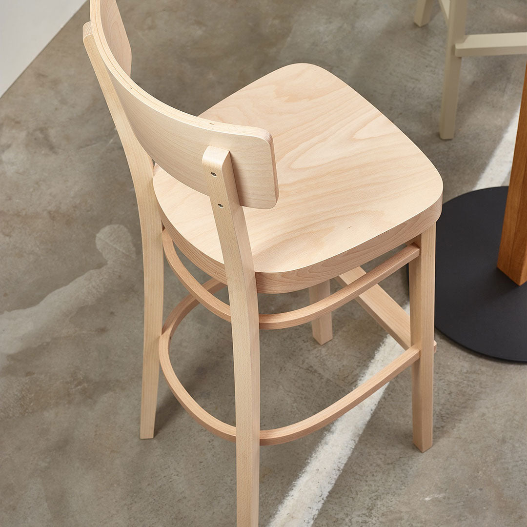 Natural wood barstool with a smooth light beige finish and simple, elegant design. Perfect for modern interiors.
