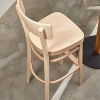 Natural wood barstool with a smooth light beige finish and simple, elegant design. Perfect for modern interiors.