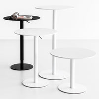 "Modern side tables in black and white, featuring sleek round tops and minimalist design."
