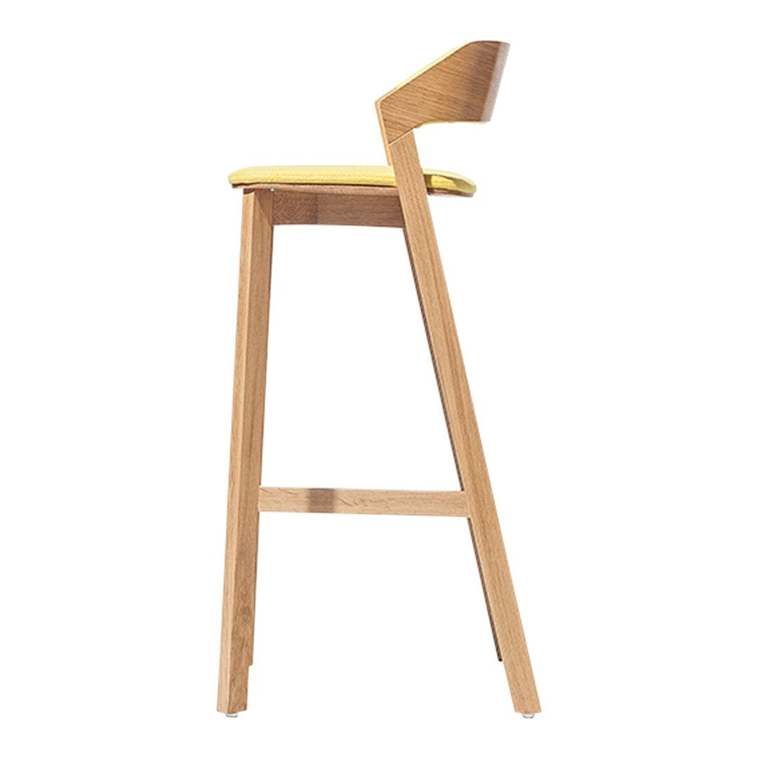 Wooden bar stool with a smooth light wood finish and a vibrant yellow cushion for a pop of color.