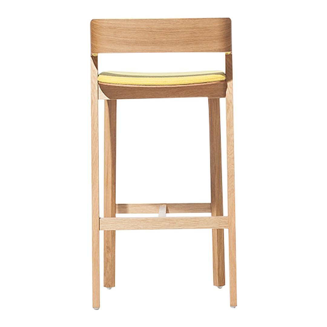 Light wood bar stool with a sleek design and a vibrant yellow cushion, featuring minimalist style and modern elegance.